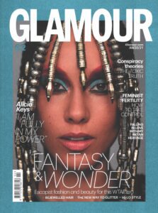A woman with dreadlocks and blue eyes on the cover of glamour magazine.